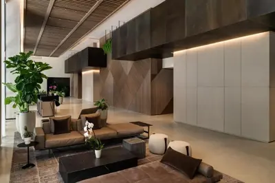 a living room with a couch and a table at 40th floor lux condo with pool, gym and spa access in Miami