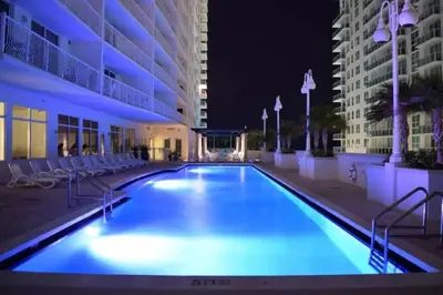 a swimming pool in the middle of a building at night at Stylish Renovated 3BR Condo Bay Views plus Parking in Miami