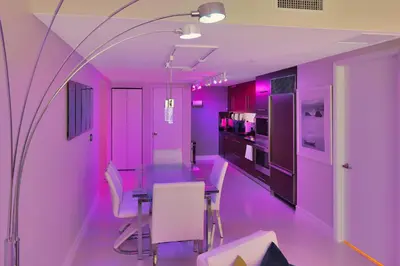 a purple dining room with a table and chairs at Icon Brickell 20th Floor 1BR Pool View Balcony in Miami