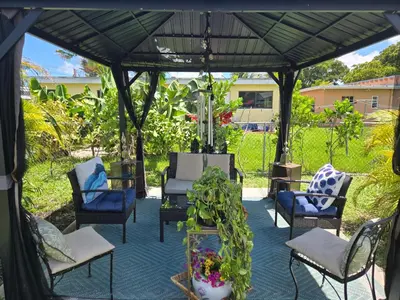 a group of chairs under a gazebo at Little Wynwood Oasis in Miami