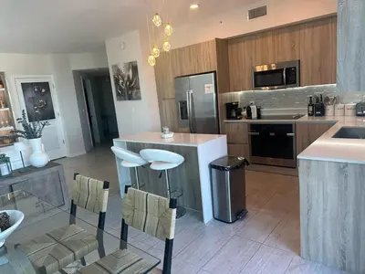 a kitchen with a counter and a counter top at Luxury Penthouse Water Views Massive Terrace in Miami