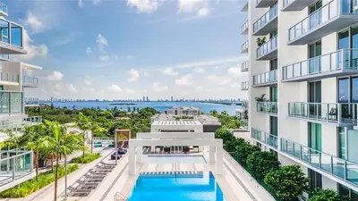 an aerial view of an apartment building with a swimming pool at Luxury Penthouse Water Views Massive Terrace in Miami