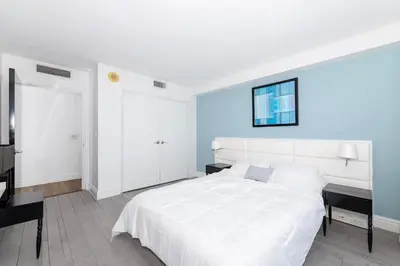 a bedroom with a large white bed and a window at 2 King Rooms Mondrian Resort Skyline Bay Balcony in Miami Beach