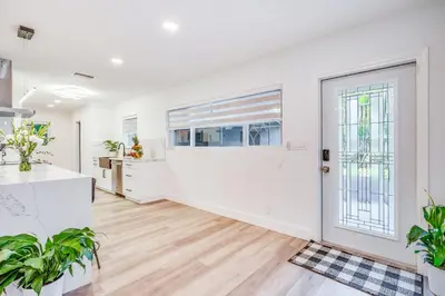 an empty kitchen and living room with a large door at Fox Private Resort- Near Downtown & Beach in Fort Lauderdale