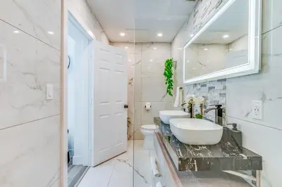 a bathroom with a sink and a toilet at Fox Private Resort- Near Downtown & Beach in Fort Lauderdale