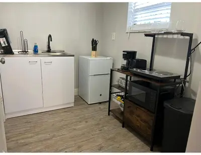 a kitchen with a counter and a sink and a desk at Studios & Coral Gable, close to downtown and airport in Miami