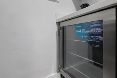 a microwave with a sign on the side of it at Harding Apartments by Andes STR in Miami Beach
