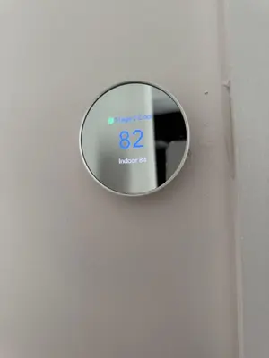 a mirror on a wall with a clock on it at Stylish Miami Getaway in Miami