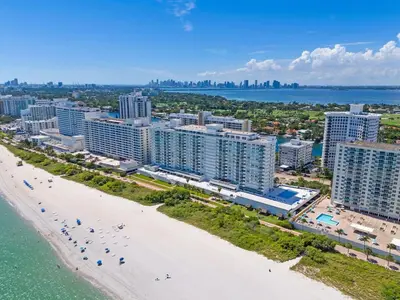 an aerial view of a beach and buildings at Elara Beachfront 2 Bedrooms Direct OceanView with Parking in Miami Beach