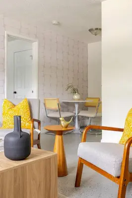 a living room with chairs and a table at Your Modern South Florida Oasis Comfy and Central in Fort Lauderdale