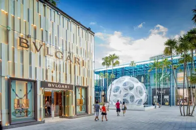 a rendering of a shopping center with people walking in front of a building at Luxury 1BR in Quadro Miami with Pool and Parking in Miami