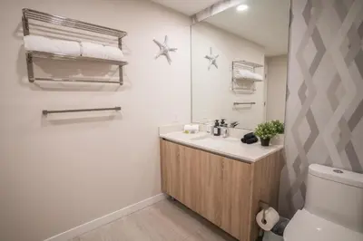 a bathroom with a sink and a toilet at Luxury 1BR in Quadro Miami with Pool and Parking in Miami