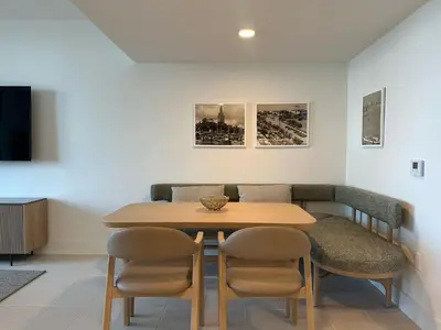 a dining room with a wooden table and chairs at Downtown Miami view - 38th floor gem in Miami