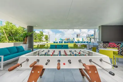 a room with a foosball game on a table at High Floor Unit Heart Of Miami with pool and gym in Miami