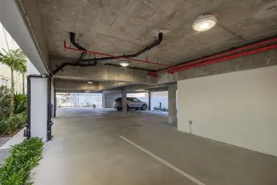 a parking garage with a car parked in it at Modern South Beach 2 Bedroom Gem in Miami Beach