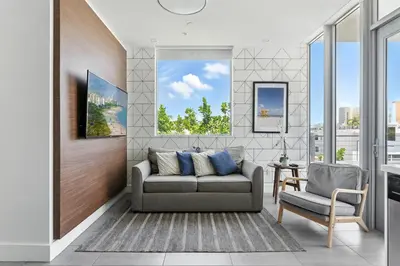 a living room with a couch and a chair at SoBe 2 Bedroom Near Ocean Drive in Miami Beach