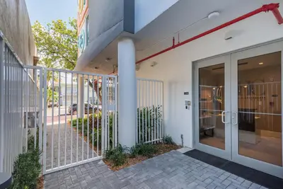 an entrance to a building with a glass door at South Beach Stylish 2BR Retreat in Miami Beach