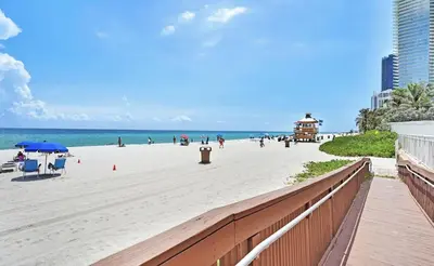 a view of a beach with people on it at Pet Friendly Studio Beach and Pool Access, gym ! in Sunny Isles Beach