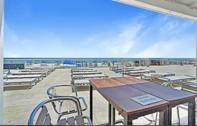 a picnic table and chairs on the beach at Pet Friendly Studio Beach and Pool Access, gym ! in Sunny Isles Beach