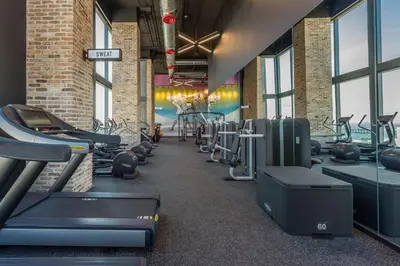 a gym with several treadmills and cardio machines at Amazing 3Beds 3Baths Corner Unit Downtown Miami in Miami