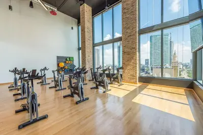 a gym with cardio equipment and large windows at Amazing 3Beds 3Baths Corner Unit Downtown Miami in Miami