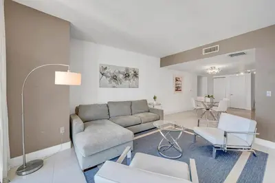 a living room with a couch and chairs at 48th Floor ocean View Brickell in Miami