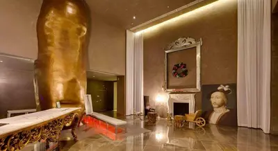 a large room with a statue and a fireplace at 40th floor High Ceilings unit at icon brickell in Miami