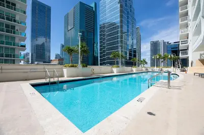 a swimming pool in a city with tall buildings at High Rise Unit in the heart of Brickell in Miami