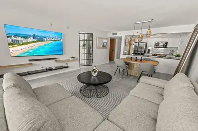 a living room with a couch and a table at High Rise Unit in the heart of Brickell in Miami