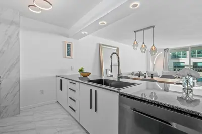 a kitchen with a sink and a counter at High Rise Unit in the heart of Brickell in Miami
