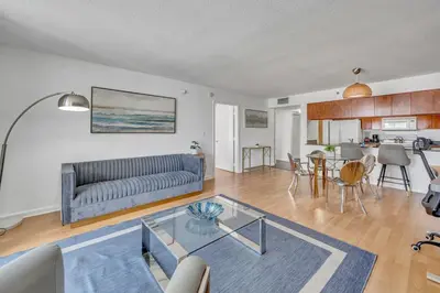 a living room with a couch and a table at Superb private unit with amenities and parking in Miami