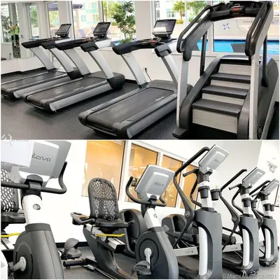 two pictures of a gym with treadmills at Luxurious 34th floor Ocean view Private Unit in Miami