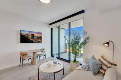 a living room with a couch and a table at Stylish Miami Condo with Beach Access at 72 Park in Miami Beach
