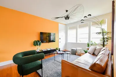 a living room with a couch and a chair at Stylish 2br apt, king-size bed, 5mins to the beach - J3 in Hollywood