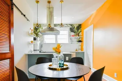 a small kitchen with a table and chairs at Stylish 2br apt, king-size bed, 5mins to the beach - J3 in Hollywood