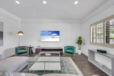 a living room with a couch and a table at Wonderful Tropical Pool House Miami South Brickell in Miami
