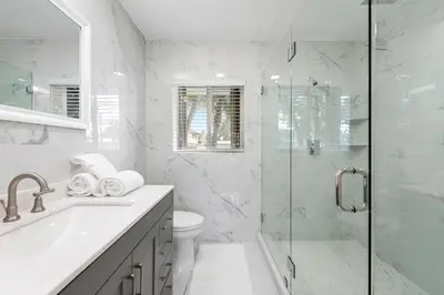 a white bathroom with a shower and a toilet at Fort Lauderdale Water Front Oasis in Fort Lauderdale