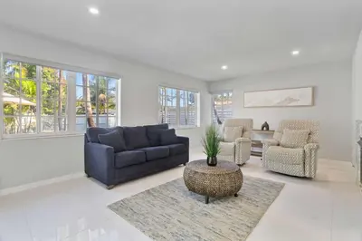 a living room with a couch and chairs and a table at Modern Hollywood 3BR House Pool Jacuzzi in Hollywood