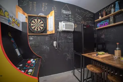 a room with a dart board on the wall at 3-Bedroom Tropical Villa with Heated Pool in Fort Lauderdale in Fort Lauderdale