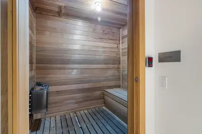 a sauna with a bench in a room at Champagne at Tiffany's - Luxury Condo by the Beach in Fort Lauderdale
