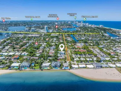 an aerial view of a resort with a map at LVS Villa Blanco 5BR Coastal Oasis with Rooftop Sunset Deck Heated Pool Spa & Walk-to-Beach Access in Fort Lauderdale