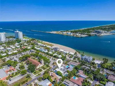 an aerial view of a beach and the ocean at LVS Villa Blanco 5BR Coastal Oasis with Rooftop Sunset Deck Heated Pool Spa & Walk-to-Beach Access in Fort Lauderdale