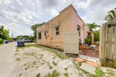 an old house with a white door on a street at 3 Mi to Beach Pet-Friendly Gem in Hollywood in Hollywood