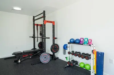 a gym with two treadmills and balls in a room at New Spacious 3BR Apt With Rooftop Pool 2 Parking in Hollywood