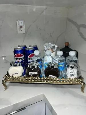 a shelf with a bunch of bottles of water at Miami City Escape in Hialeah