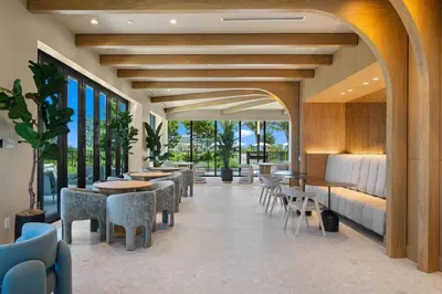 a restaurant with tables and chairs and windows at New 1Bed 1 bath Ocean view in Miami Beach