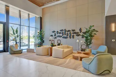 a living room with couches and chairs and windows at New 1Bed 1 bath Ocean view in Miami Beach