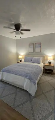 a bedroom with a bed with a ceiling fan at Aquamarina in Fort Lauderdale