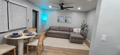 a living room with a couch and a table at Aquamarina in Fort Lauderdale