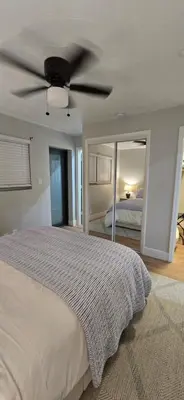 a bedroom with a bed with a ceiling fan at Aquamarina in Fort Lauderdale